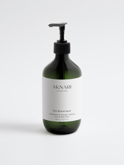 Green Iles Botanique Hand and Body Wash pump bottle with white label in front of white background. 